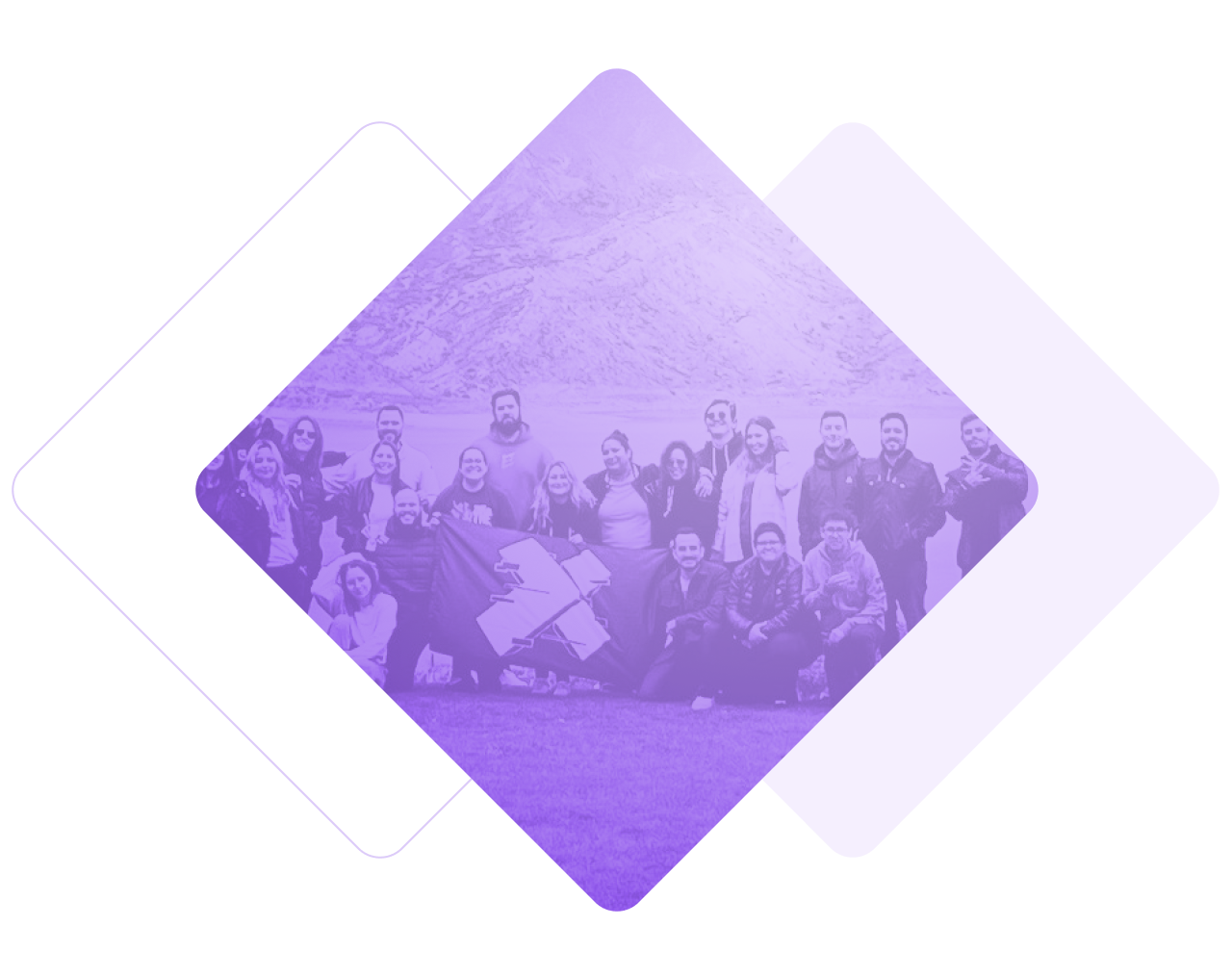 Image of X-Teamers at a team retreat. They are holding a flag with the X-Team logo.