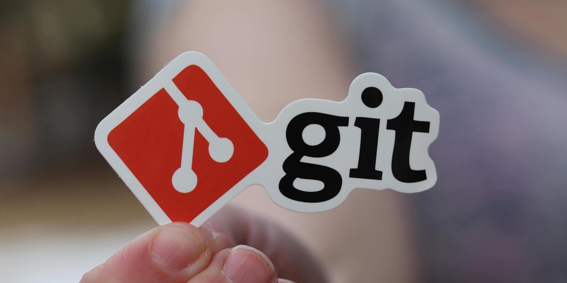 Someone holding a printed Git logo