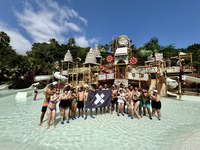 A group of X-Teamers in front of a water slide