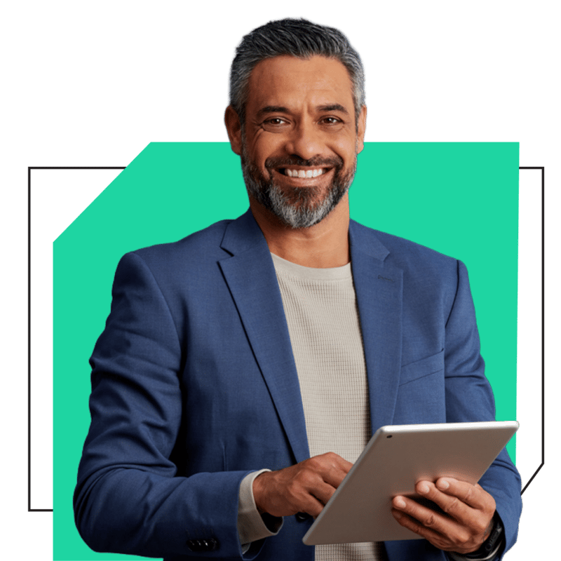 Senior X-Team engineer in a blue blazer holding a tablet — green accent shape