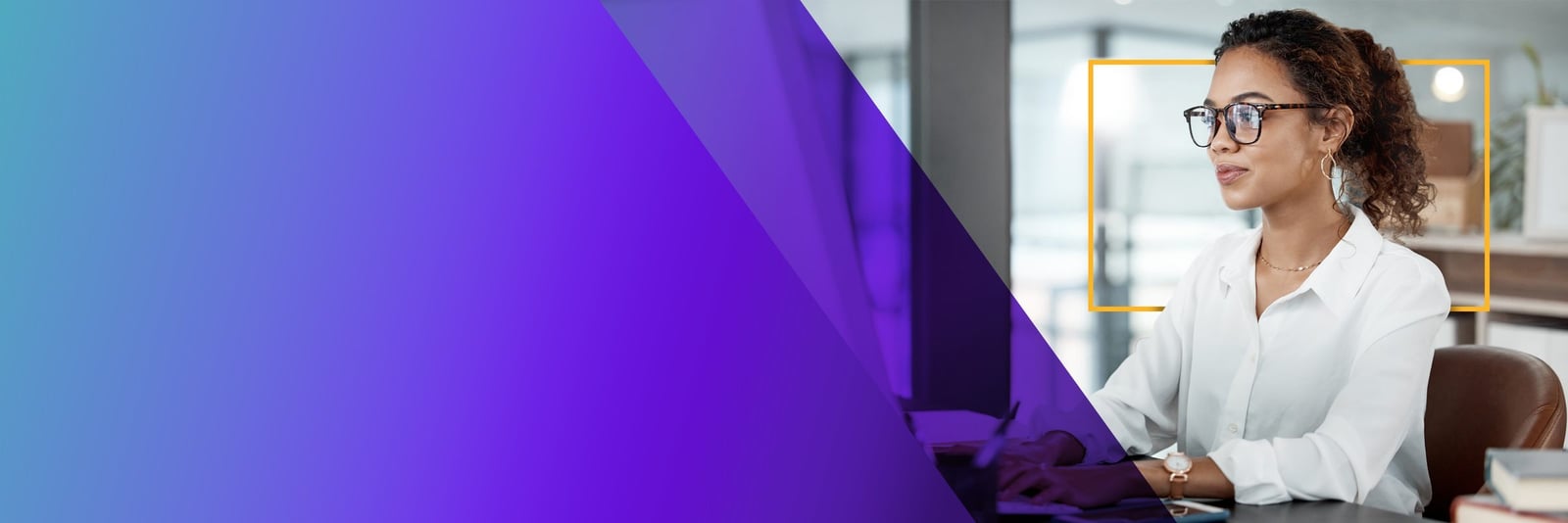 Businesswoman working on a laptop in a bright modern office